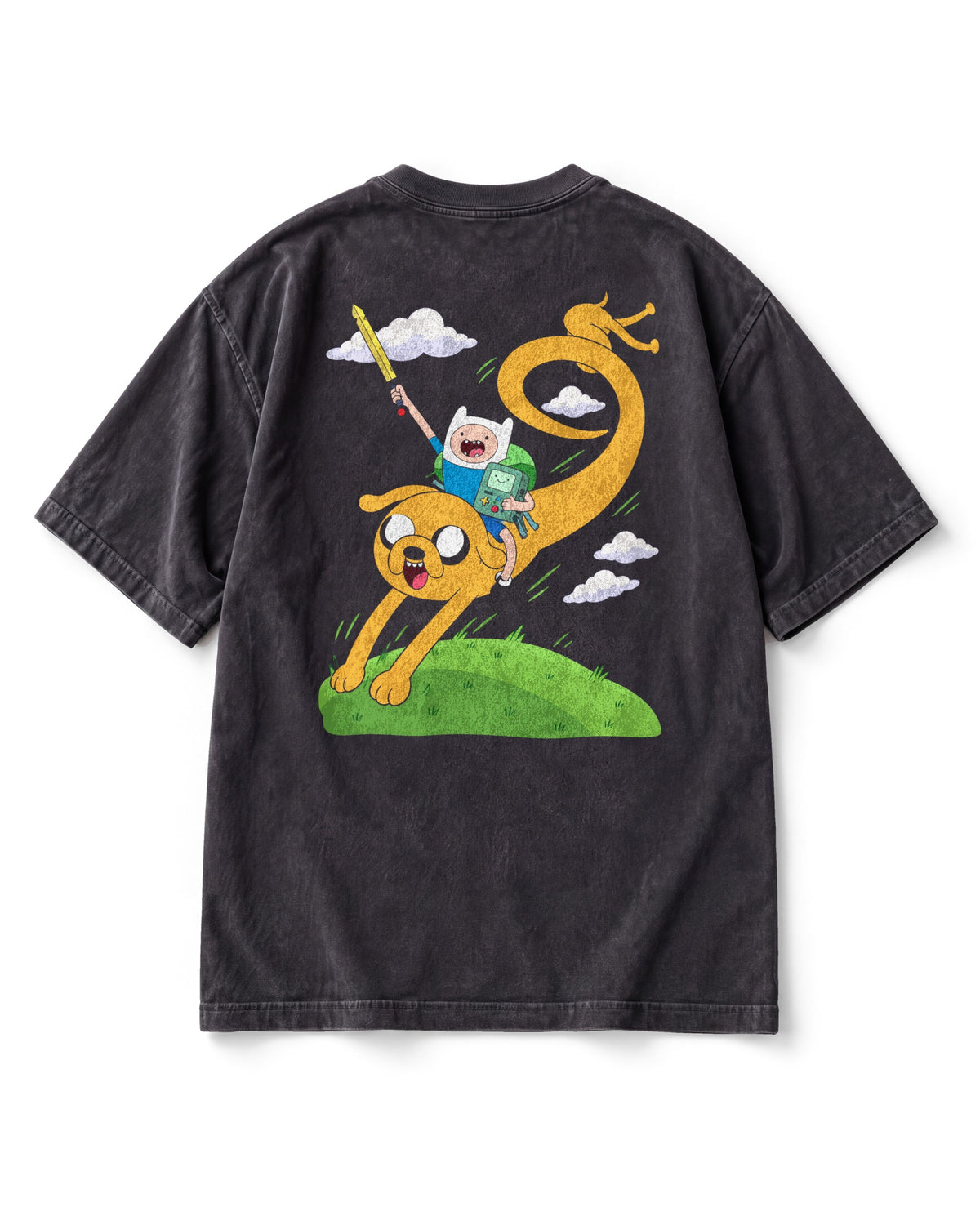 Back print: Finn in a white hat with his sword raised riding a stretched-out Jake over a green hill, BMO under his arm.